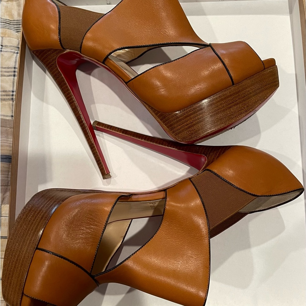 Christian Louboutin heels. Worn out on the ball of the foot area.